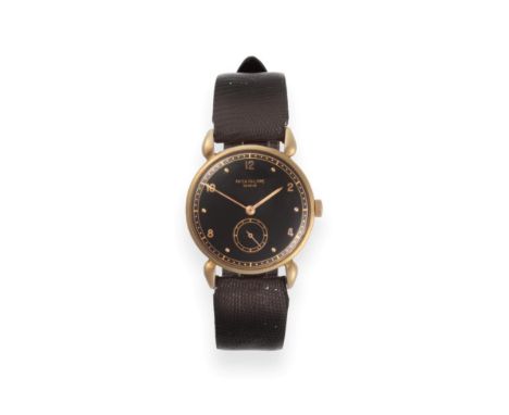 A Rare Black Dial 18ct Yellow Gold Wristwatch with Claw Shaped Lugs, signed Patek Philippe, ref: 590, manufactured in 1940, S