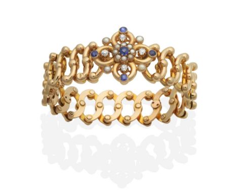 A Victorian Sapphire, Diamond and Seed Pearl 'Baden' Patent Expanding Bracelet, a central round cut sapphire within a border 