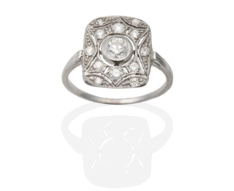 An Art Deco Style Diamond Plaque Ring, a round brilliant cut diamond within a diamond set pierced milgrain frame, total estim