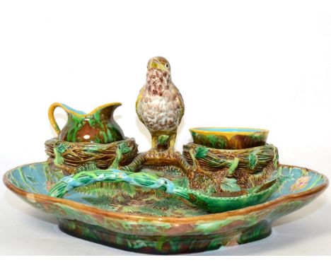 A George Jones Majolica Strawberry Set, circa 1870, the dish of shaped oval form with bird handle, together with a milk jug, 