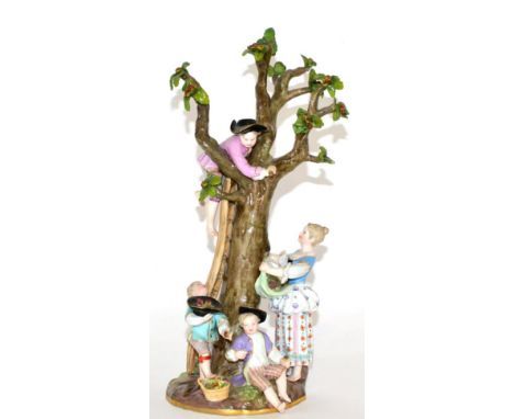 A Meissen Porcelain Figure Group of the Apple Pickers, circa 1880, with a boy climbing a ladder beside the tree, a girl catch