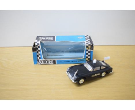 A Mini Models Tri-ang Scalextric Car, E5 Marshal's Car in black with both white flags present, driver wearing yellow helmet, 