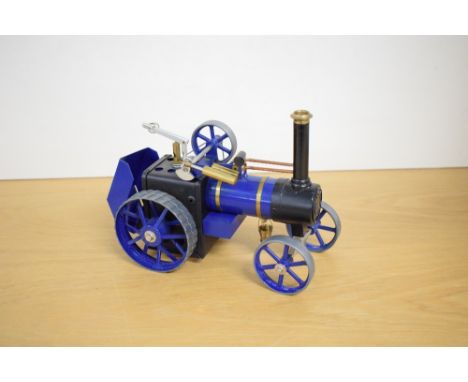 A Mamod Live Steam Traction Engine, blue and brass, with bucket present
