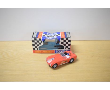 A Tri-ang Scalextric Race Tuned Car, C78 AC Cobra Sports in red with racing number 6 and Titan with Scalextric decal, driver 