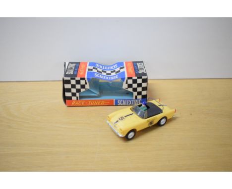 A Tri-ang Scalextric Race Tuned Car, C83 Sunbeam Tiger in yellow with racing number 5 and race tuned decal, driver wearing bl