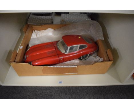 A 1964 Monogram Models Inc plastic scale model, Jaguar E Type, made up with two loose front wheels present