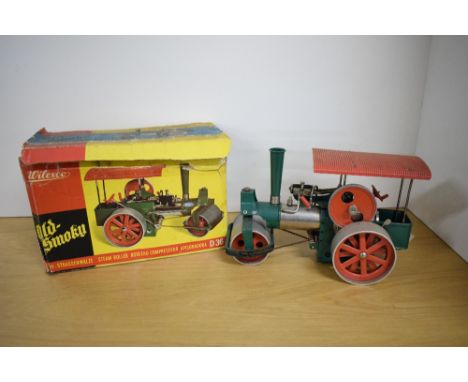 A Wilesco D36 Old Smokey's Live Steam Roller, boxed, appears in good condition, burner tray missing, box tired