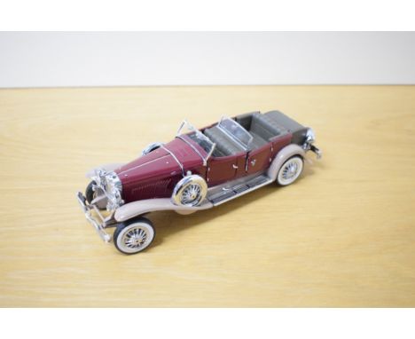 A 1987 Franklin Mint 1:24 scale Die-cast, 1930 Duessenberg J Derham Tourster with tag,Letter how to Care for this model and t