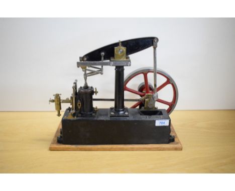 A Stuart Turner Live Steam Beam Engine having spoked flywheel, metal base numbered 80063, length of metal base 33cm, length o