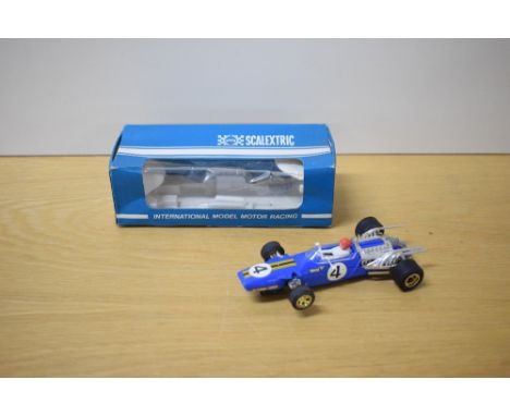 A Rovex Scalextric Car, C14A Matra GP in blue with racing number 4, driver wearing red helmet, in original window display box