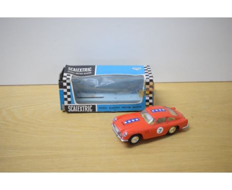 A Mini Models Tri-ang Scalextric Car, C68 Aston Martin DB4 GT in red with racing number 7 and stars decals, driver wearing ye