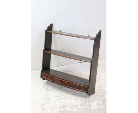 Mahogany wall shelf with three drawers 