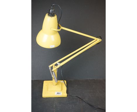 A vintage Herbert Terry two step angle poise yellow table lamp. 