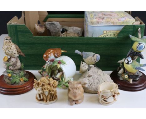 A collection of ceramic and resin ornaments to include Border Fine Arts The World Of Beatrix Potter. 
