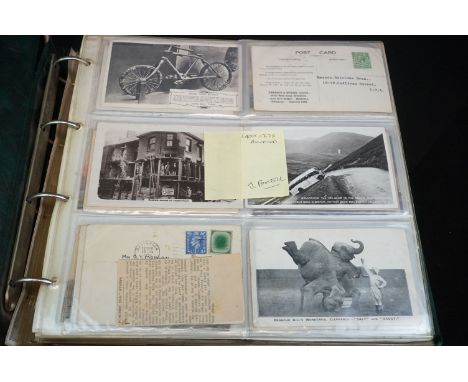 A large collection of vintage postcards contained within an album to include real photograph and printed examples including S