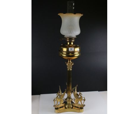 Late 19th / Early 20th century Tall Oil Lamp on Corinthian Column Brass Base, the triangular base cast with three Griffins, a