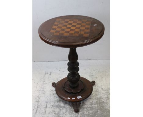 Victorian Walnut Circular Games Table, the top inlaid with a Rosewood and Boxwood Chess Board, raised on a turned pedestal su