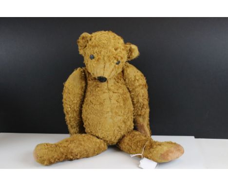 Antique style jointed teddy bear with button eyes and hump