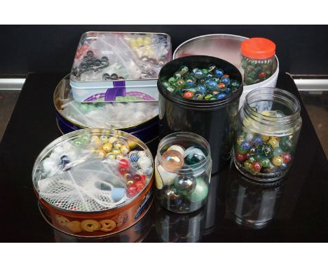 A large collection of vintage and contemporary marbles contained within various boxes. 