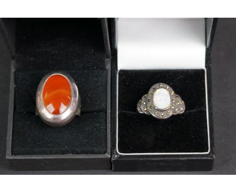 A collection of three boxed ladies 925 sterling silver rings to include an Opal and marcasite example. 