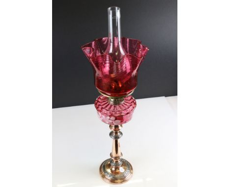 Late 19th / Early 20th century Oil Lamp with Cranberry Glass Font with pate sur pate floral decoration, copper and silver pla