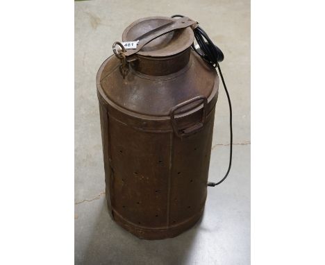 A vintage milk urn converted into a lamp. 