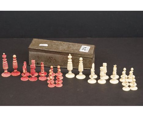 A vintage carved bone chess set in metal box. 