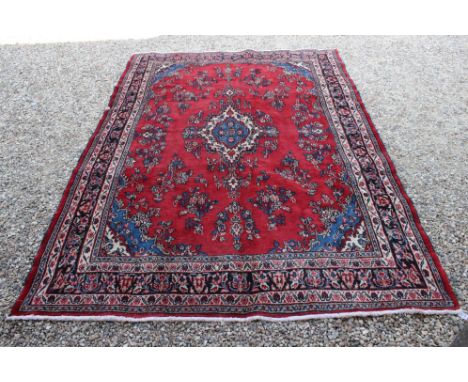 Red &amp; blue ground handwoven Persian Surok carpet, floral medallion design, approx. 320cm x 220cm 