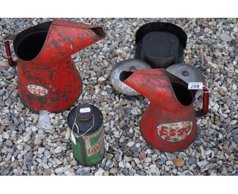 Three vintage oil advertising cans to include Esso and Castrol together with an exterior bell. 