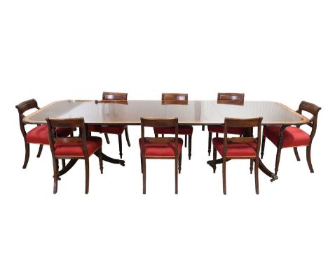 A set of eight Regency mahogany dining chairs, the set comprises six single and two-carver chairs, with scroll backs and stuf