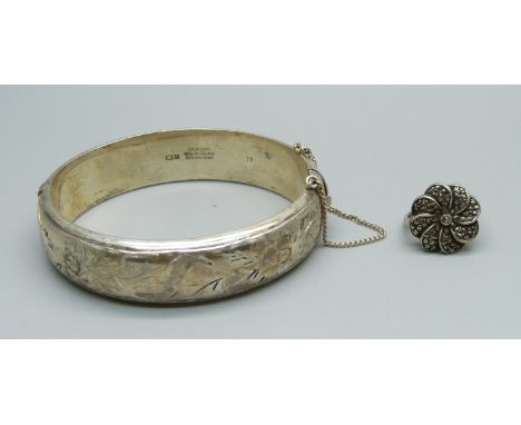 A silver bangle, 32g, and a silver ring, L/M 