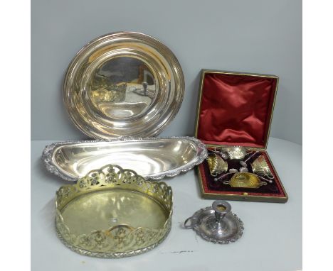 A cased set of four late Victorian plated salts, a chamber stick and two dishes on a stand/base **PLEASE NOTE THIS LOT IS NOT