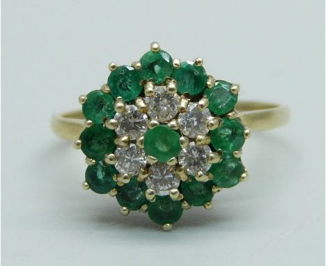 A 9ct gold, emerald and diamond cluster ring, 13 emeralds and 6 diamonds, R, 2.9g, Birmingham 1988 