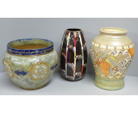 A Charlotte Rhead vase, hole for cable from lamp base, a German vase and a Doulton Lambeth Slater's Patent jardiniere 