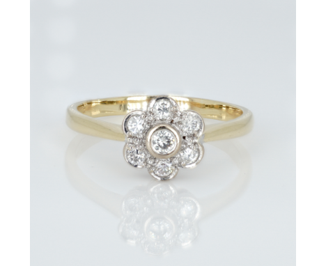 An 18ct gold and diamond cluster ring, 0.33ct diamond weight marked on the shank, ring size R½, weight 3.5g