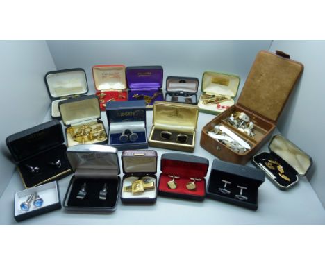 A large collection of cufflinks and tie-pins 