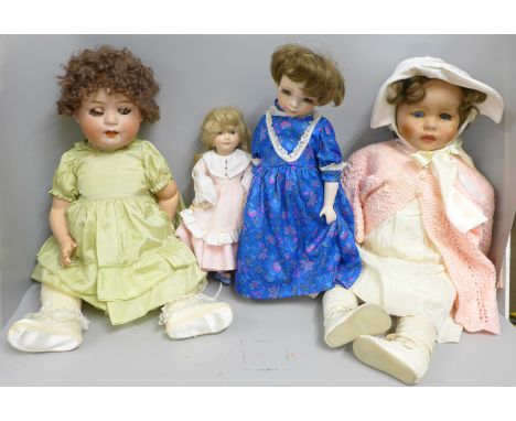 A box of four vintage and modern dolls 