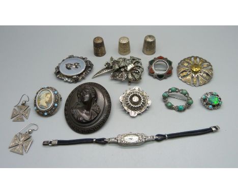 Antique jewellery; a carved cameo brooch, a Scottish silver brooch, a Victorian silver brooch, an opal set brooch, other broo