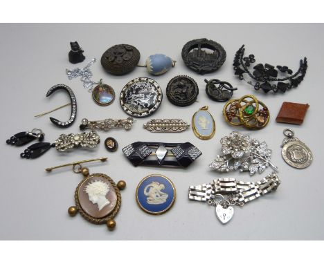 A bog oak brooch depicting a castle, pin a/f, a silver gate bracelet, a small micro-mosaic panel, a goldstone fob with compas