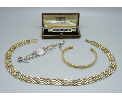 A lady's Citizen quartz wristwatch, an Art Deco brooch, cased (one stone loose), a gold-tone necklace and a bangle 