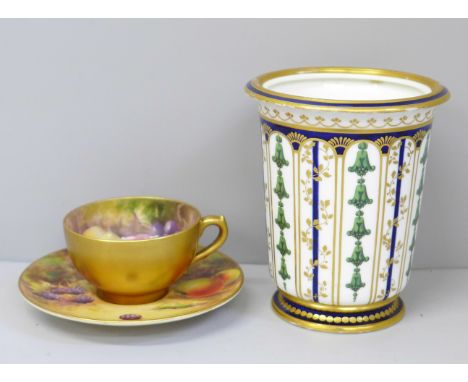 A Royal Worcester miniature cup and saucer, hand painted with fruit, the cup signed Ricketts and the saucer signed WH Austin,