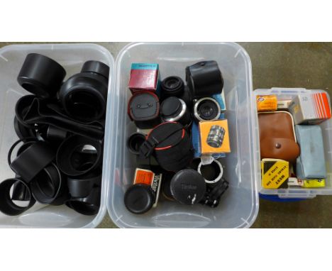 A box of vintage flash cubes and a box of lens hoods and lens extension tubes 