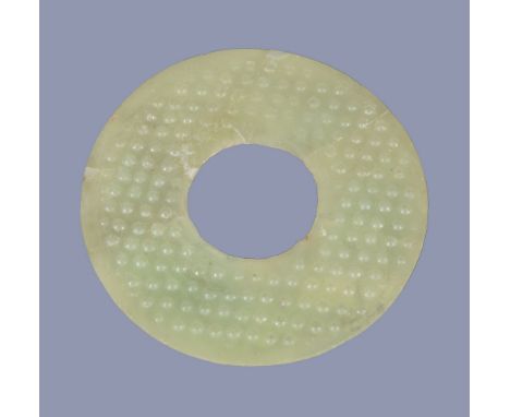 A Chinese glass disc ,  bi  , of celadon colour imitating jade, possibly Warring States-Han Dynasty, 8.9cm diameter Provenanc