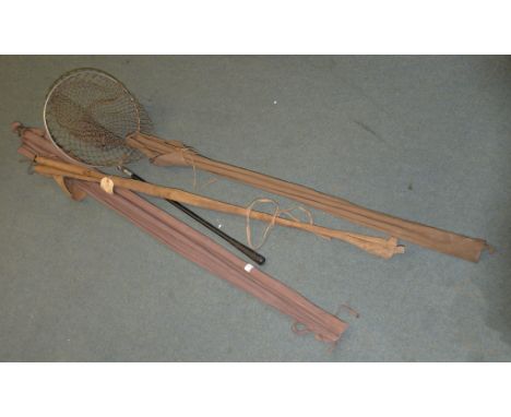 A quantity of various vintage fishing equipment including a split cane fishing rod, a landing net, an Army  &  Navy salmon ro