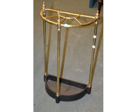 A Brass stick stand with integral cast iron drip pan base, late 19th century,  