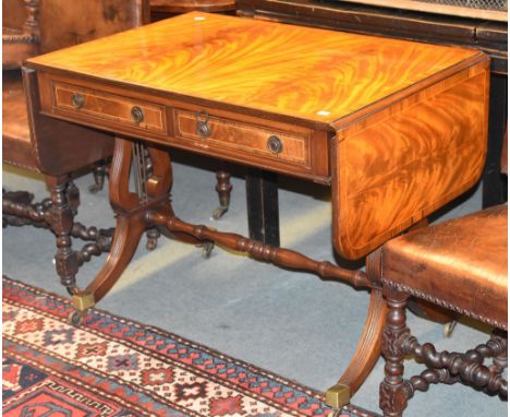 A mahogany sofa table in Regency style, 20th century  Provenance: The collection of the late Ronnie Kirkwood and George Dixon