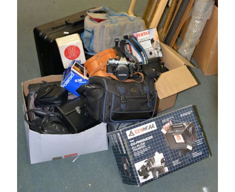 A collection of various cameras, video recording equipment, and field glasses, including an Olympus OM10 camera with Miranda 