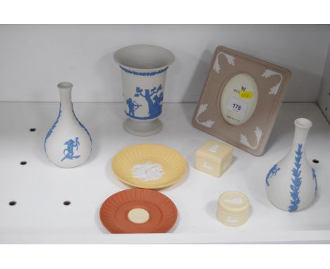 Wedgwood beige Jasper ware photograph frame, white Jasper ware vase, a pair of spill vases, yellow Jasper ware pin dishes and