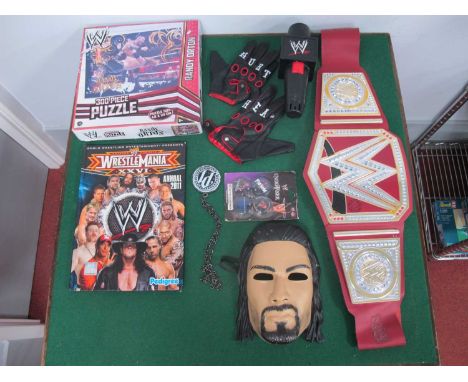 A Collection of WWE Wrestling Themed Items by Mattel, Pedigree and other, to include WWE Universal Championship Belt, Fan Mas