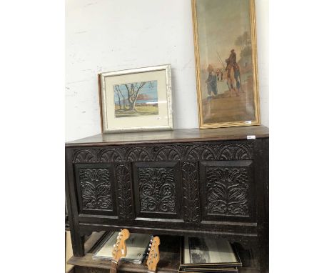 An 18th-century carved oak coffer. 